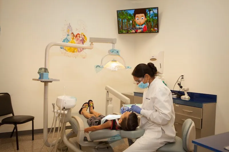 Photo of child patient being treated in chair