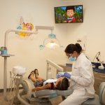 Photo of child patient being treated in chair