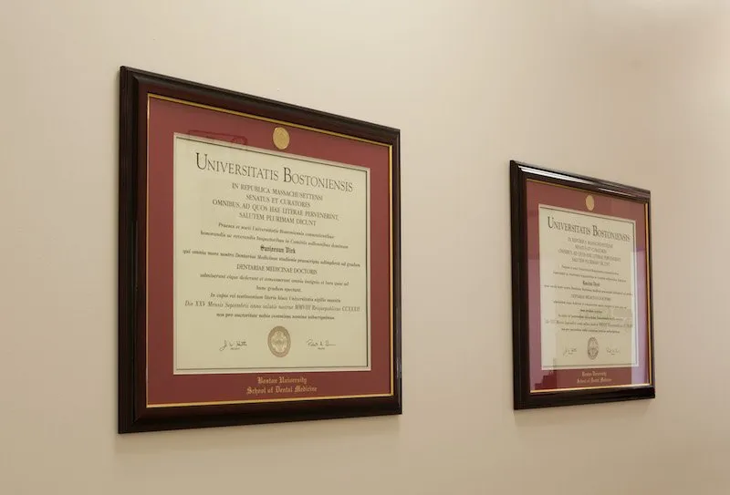 Dentist awards displayed on wall